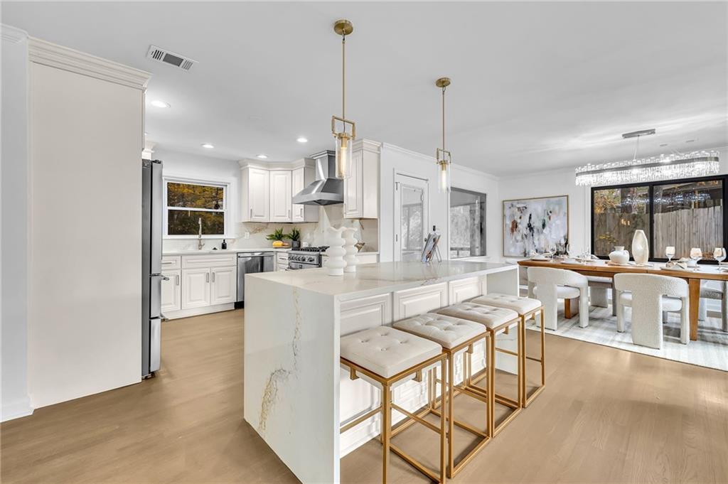 1306 Poplarcrest Circle Southeast Atlanta, GA 30316 - Photo 7 of 24 a living room with stainless steel appliances kitchen island granite countertop furniture and a kitchen view