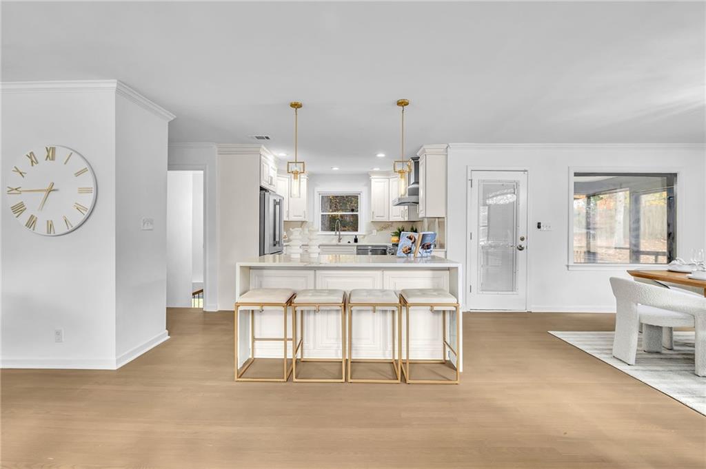 1306 Poplarcrest Circle Southeast Atlanta, GA 30316 - Photo 8 of 24 a kitchen with stainless steel appliances kitchen island granite countertop a refrigerator a stove and white cabinets