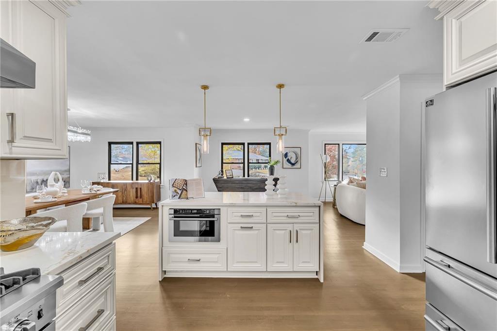 1306 Poplarcrest Circle Southeast Atlanta, GA 30316 - Photo 10 of 24 a large white kitchen with stainless steel appliances