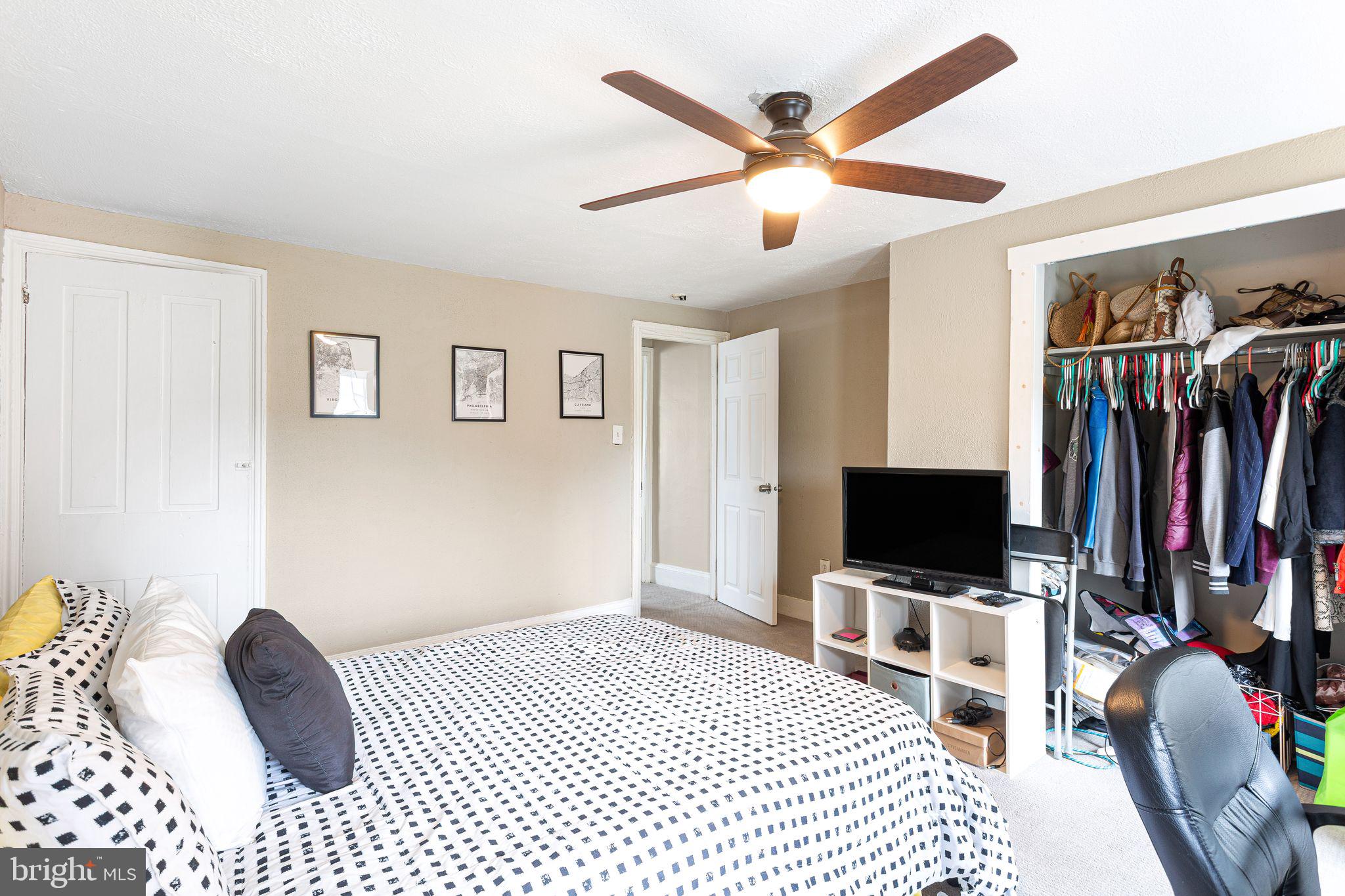 140 Wendover Street Philadelphia, PA 19127 - Photo 12 of 16 a bedroom with a bed and a flat screen tv