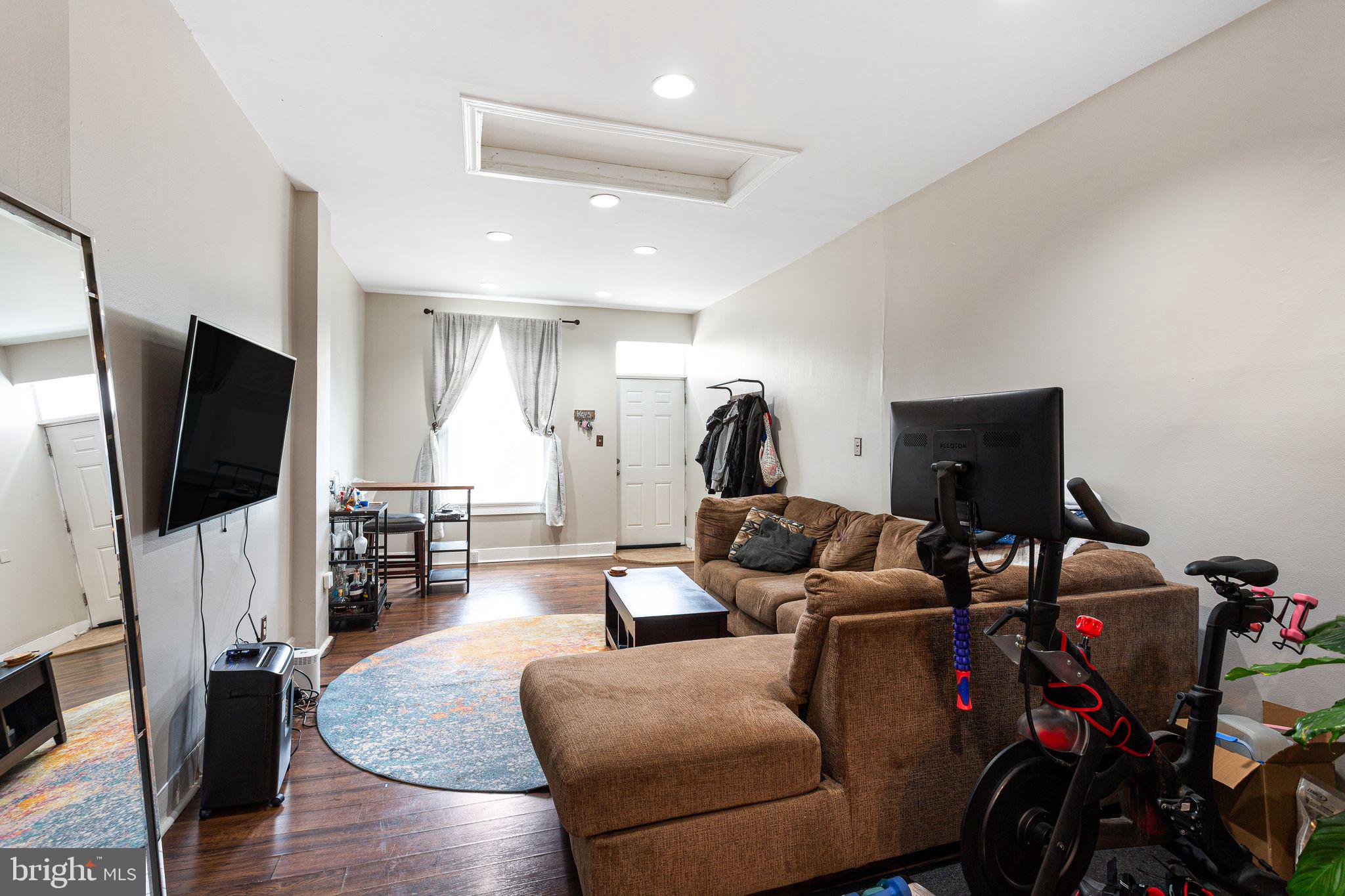 140 Wendover Street Philadelphia, PA 19127 - Photo 2 of 16 a living room with furniture and a flat screen tv