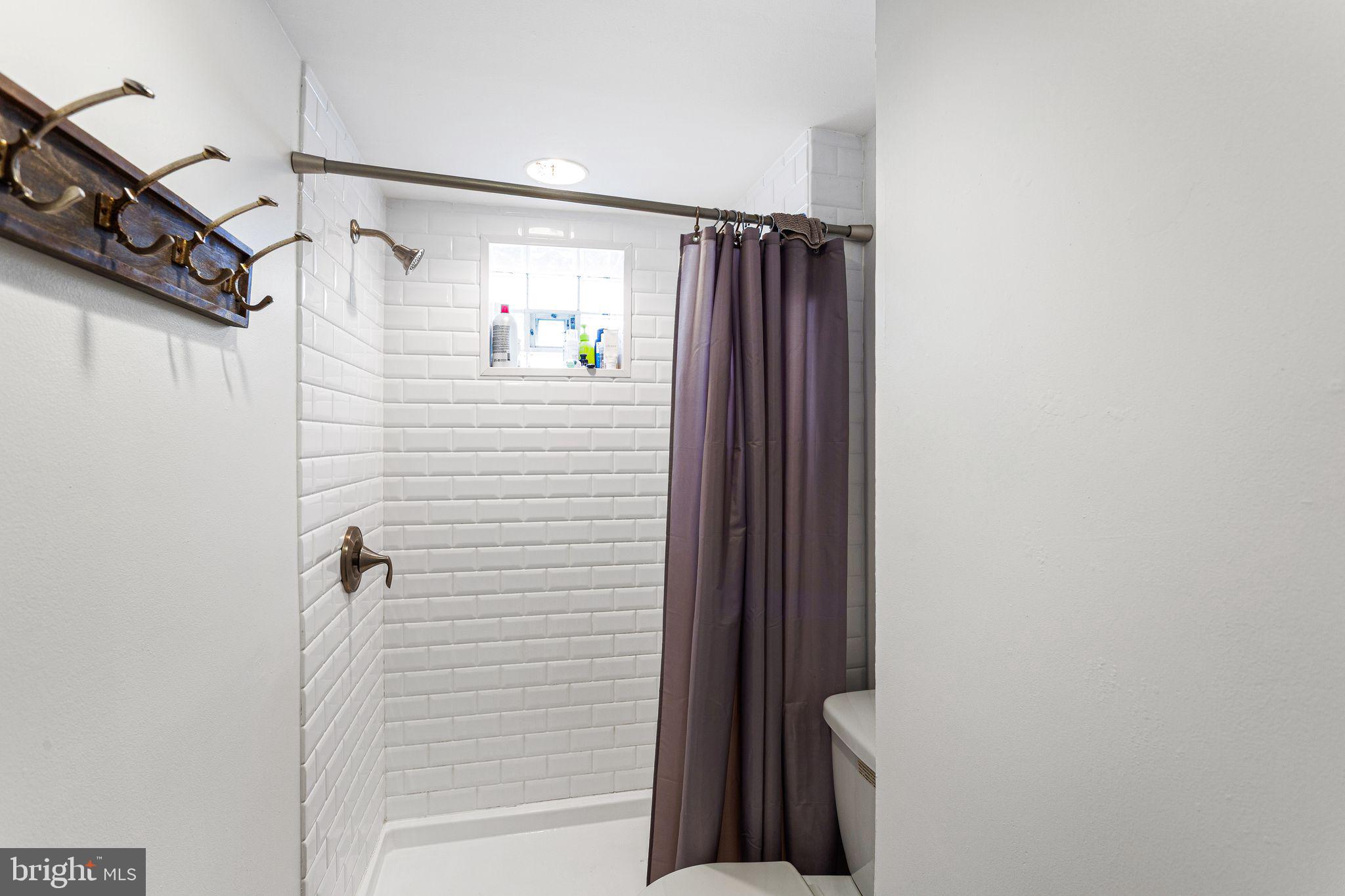 140 Wendover Street Philadelphia, PA 19127 - Photo 7 of 16 a bathroom with a shower and a shower