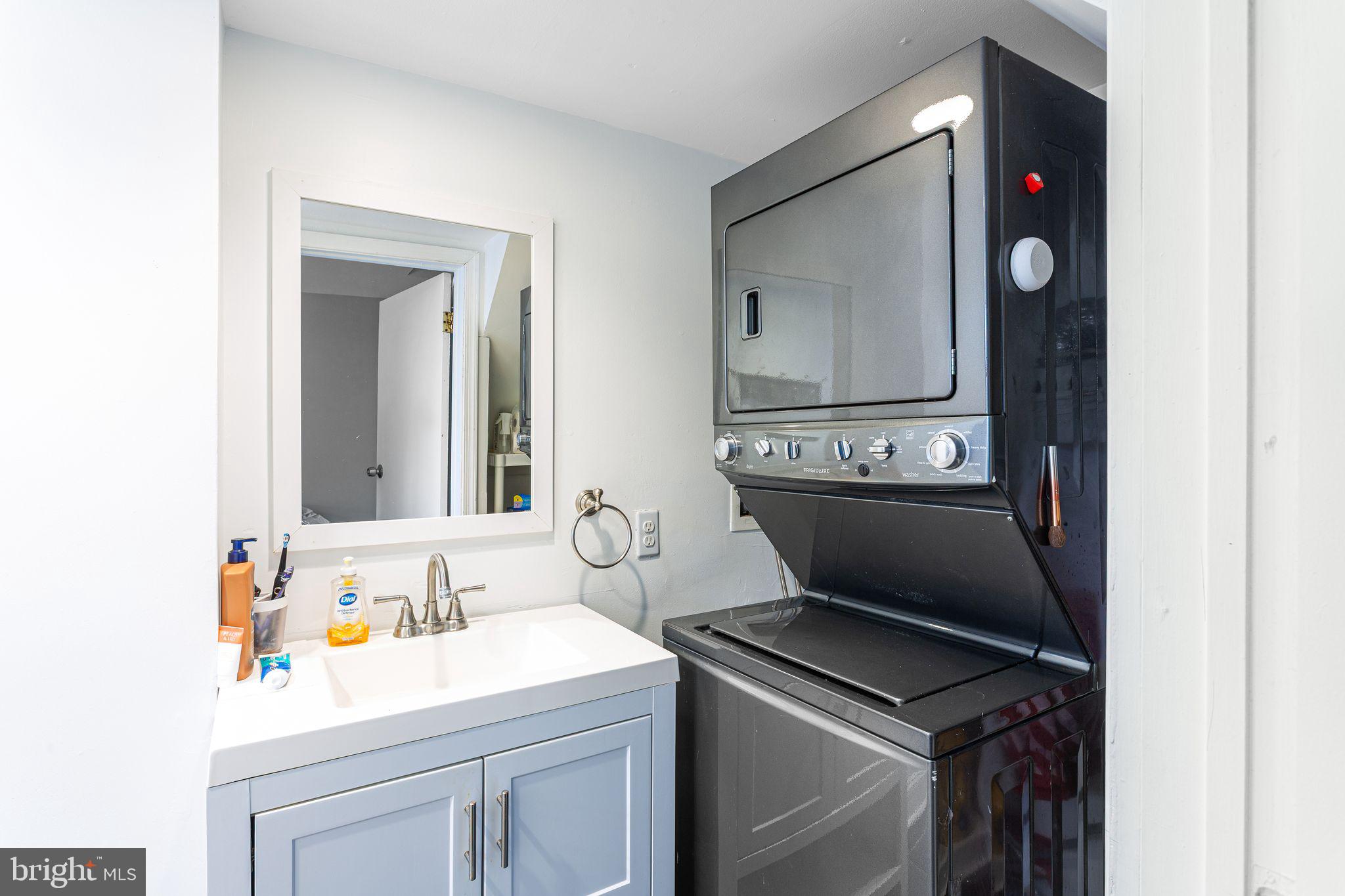 140 Wendover Street Philadelphia, PA 19127 - Photo 8 of 16 a bathroom with a sink vanity and mirror