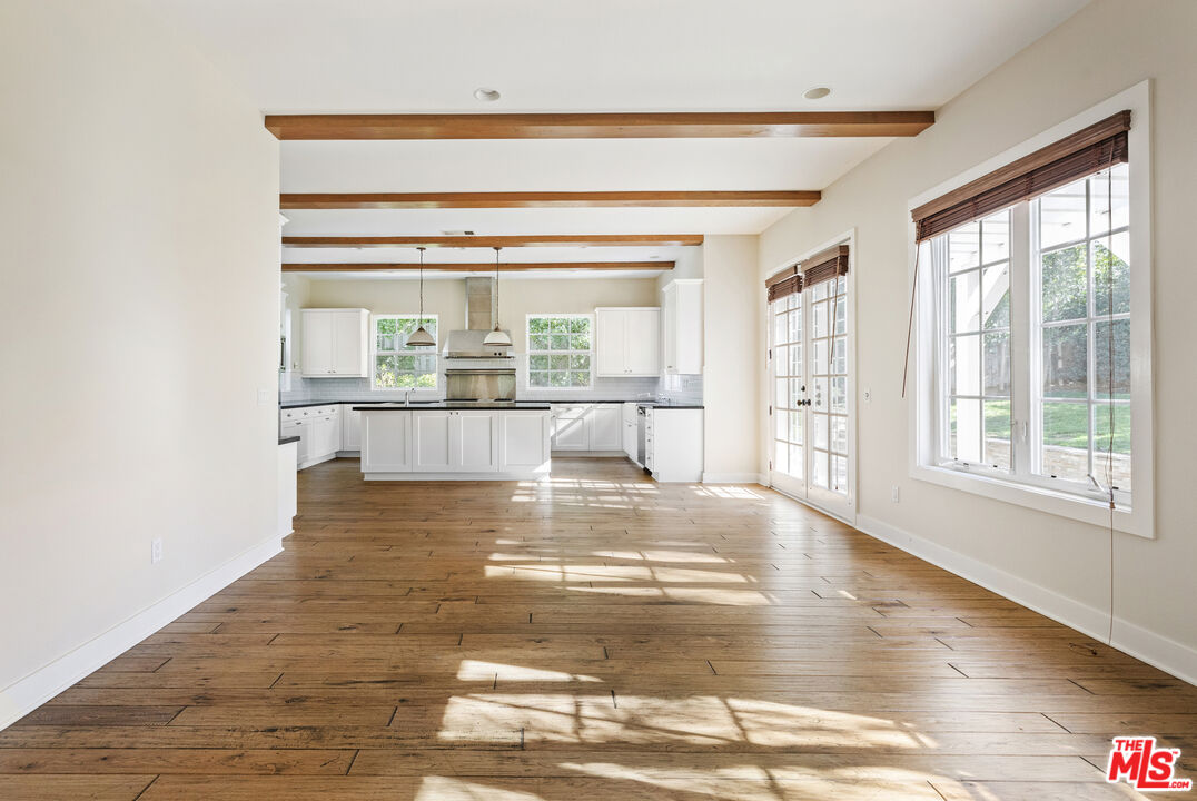 28930 Hampton Place Malibu, CA 90265 - Photo 17 of 55 a view of an empty room with wooden floor and a window