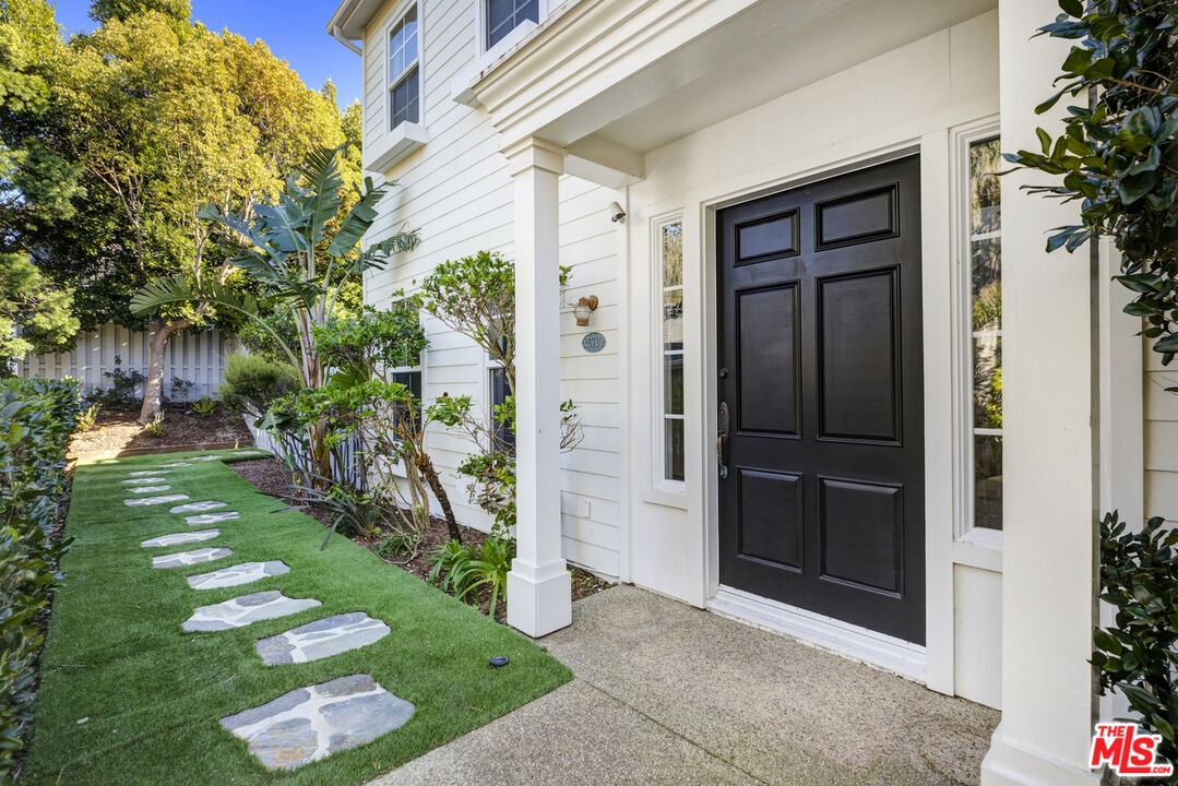 28930 Hampton Place Malibu, CA 90265 - Photo 3 of 55 a front view of a house with a yard
