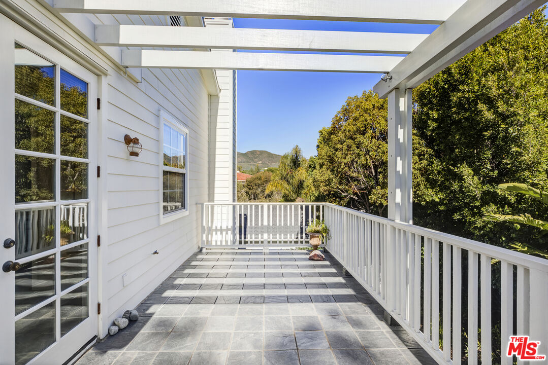 28930 Hampton Place Malibu, CA 90265 - Photo 31 of 55 a view of a balcony with wooden floor and a window