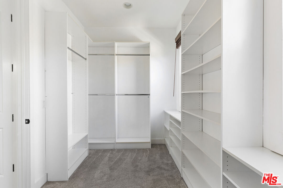 28930 Hampton Place Malibu, CA 90265 - Photo 37 of 55 a view of walk in closet with empty racks
