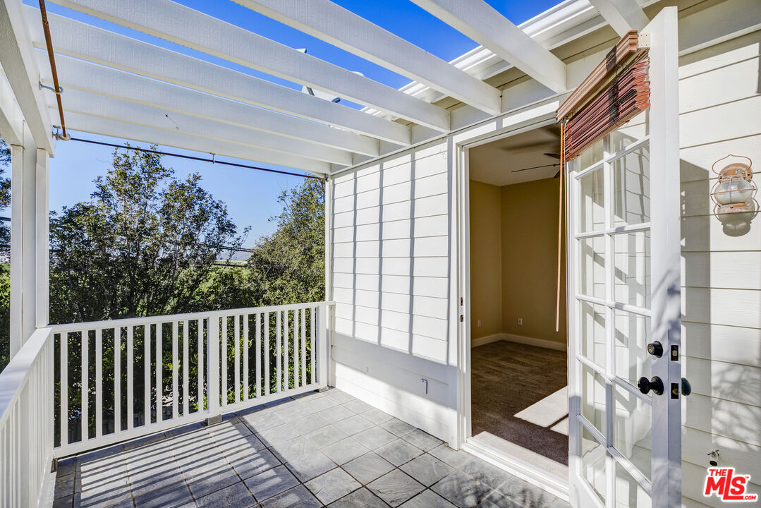 28930 Hampton Place Malibu, CA 90265 - Photo 40 of 55 a view of a balcony with wooden floor