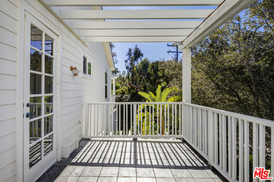 28930 Hampton Place Malibu, CA 90265 - Photo 46 of 55 a view of a balcony with wooden floor and fence