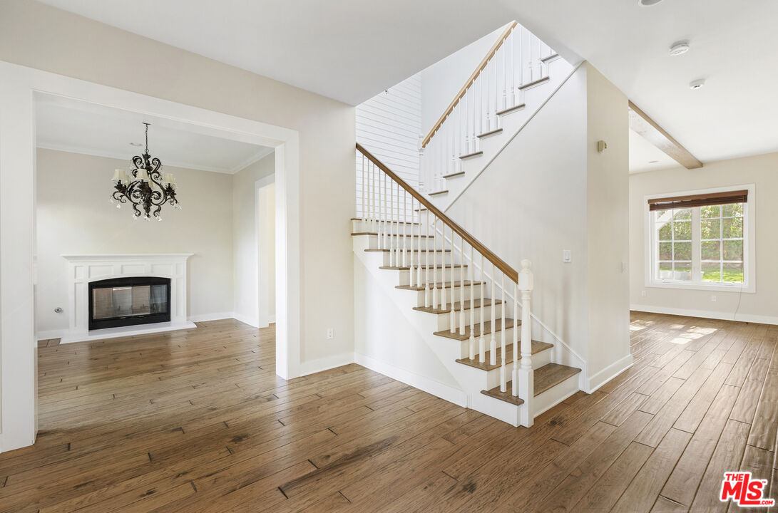 28930 Hampton Place Malibu, CA 90265 - Photo 9 of 55 a view of an entryway with wooden floor and front door