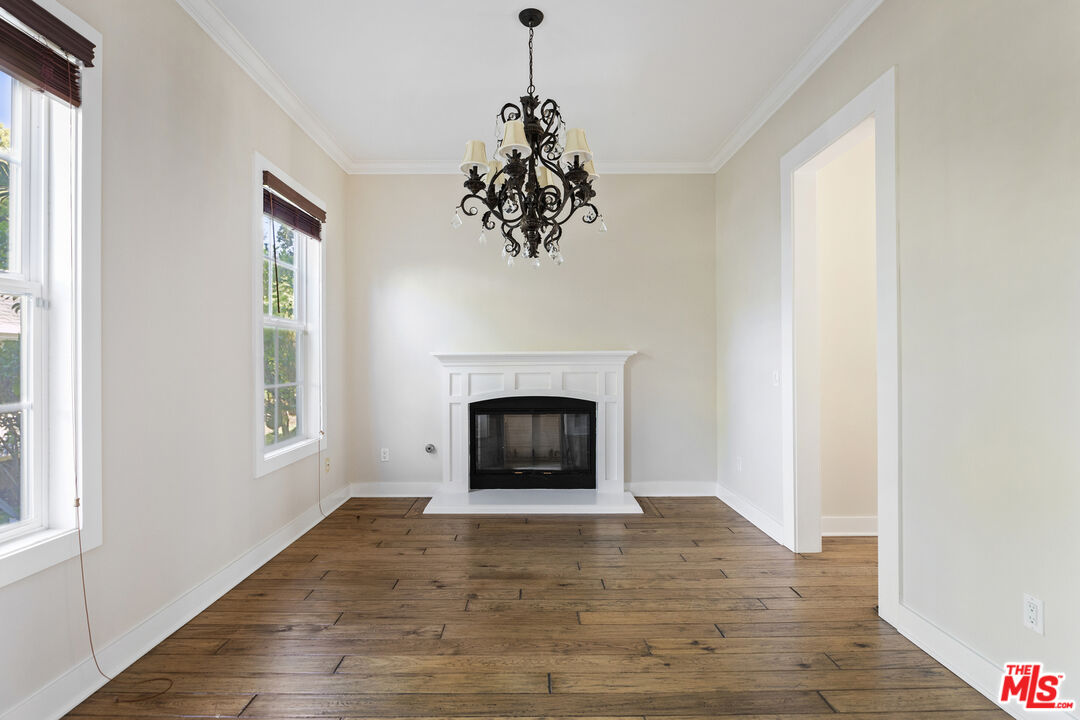 28930 Hampton Place Malibu, CA 90265 - Photo 10 of 55 a living room with a fireplace and wooden floor