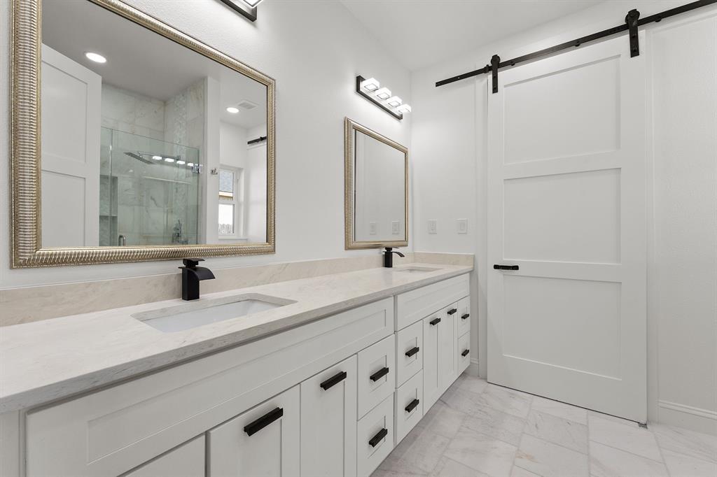 809 South Adelaide Street Terrell, TX 75160 - Photo 6 of 18 a bathroom with a double vanity sink and mirror