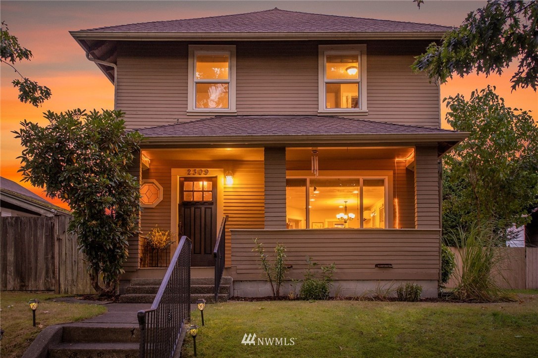 2309 Baker Avenue Everett, WA 98201 - Photo 1 of 26 a view of a house with a small yard and wooden fence