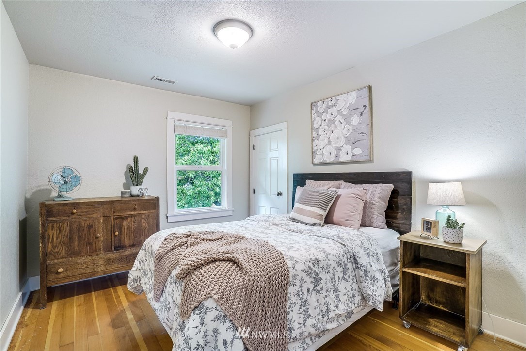 2309 Baker Avenue Everett, WA 98201 - Photo 16 of 26 a bed sitting in a bedroom next to a window