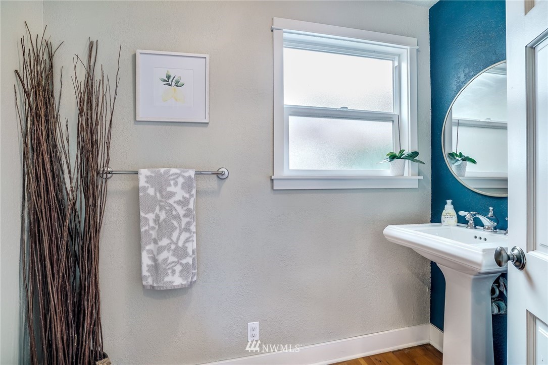 2309 Baker Avenue Everett, WA 98201 - Photo 18 of 26 a bathroom with a sink a mirror and a window