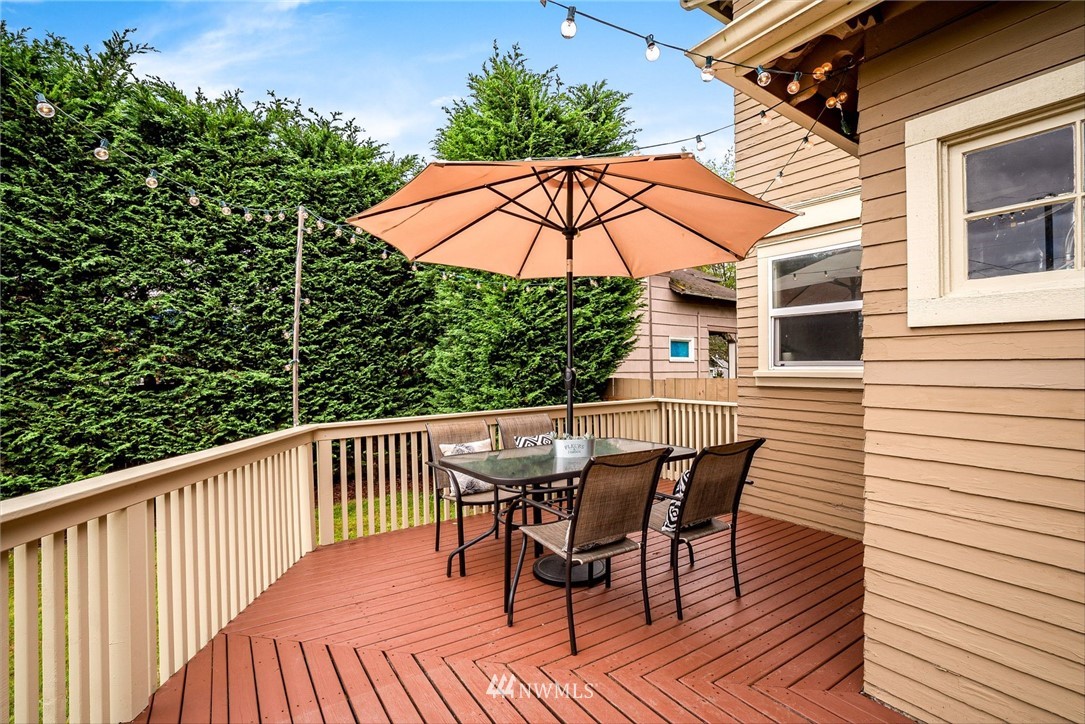 2309 Baker Avenue Everett, WA 98201 - Photo 20 of 26 a view of a deck with table and chairs under an umbrella