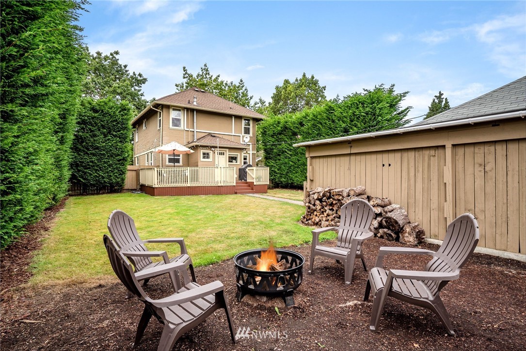 2309 Baker Avenue Everett, WA 98201 - Photo 23 of 26 a view of a chair and table in the back yard of the house