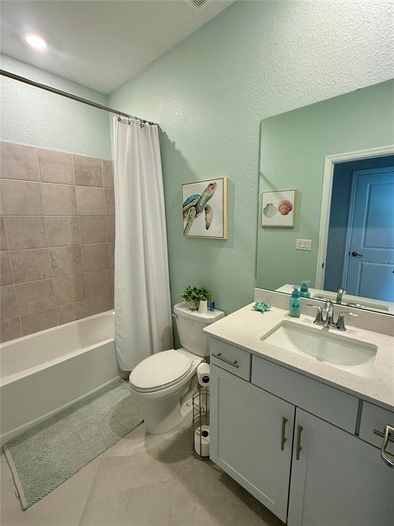 10852 Sun Drop Street Venice, FL 34293 - Photo 12 of 15 a bathroom with a sink toilet and shower