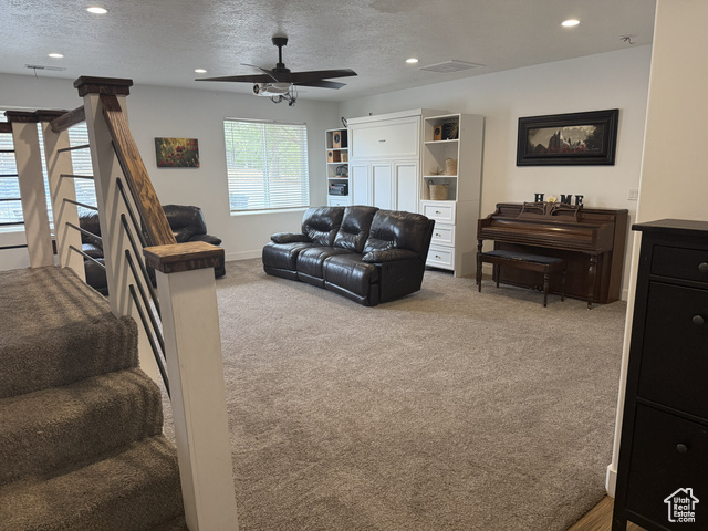 175 North 160 East Hurricane, UT 84737 - Photo 22 of 43 Living area with a textured ceiling, recessed lighting, carpet floors, and ceiling fan