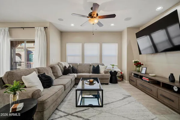 a living room with furniture and a large window