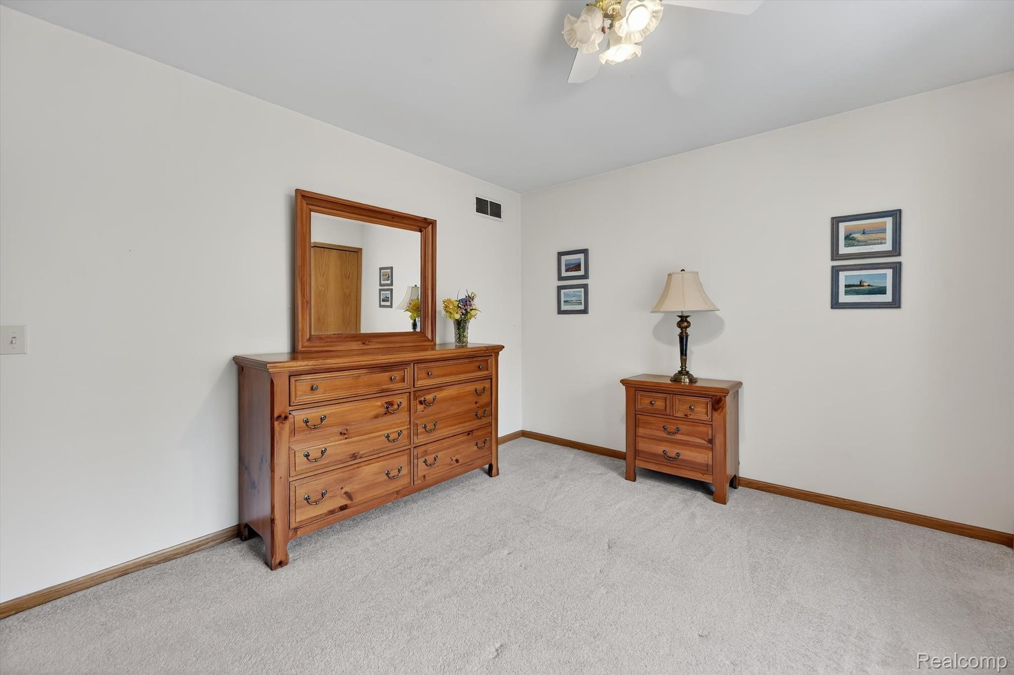 7798 Lee Road Brighton, MI 48116 - Photo 17 of 49 Bedroom with light colored carpet and a ceiling fan