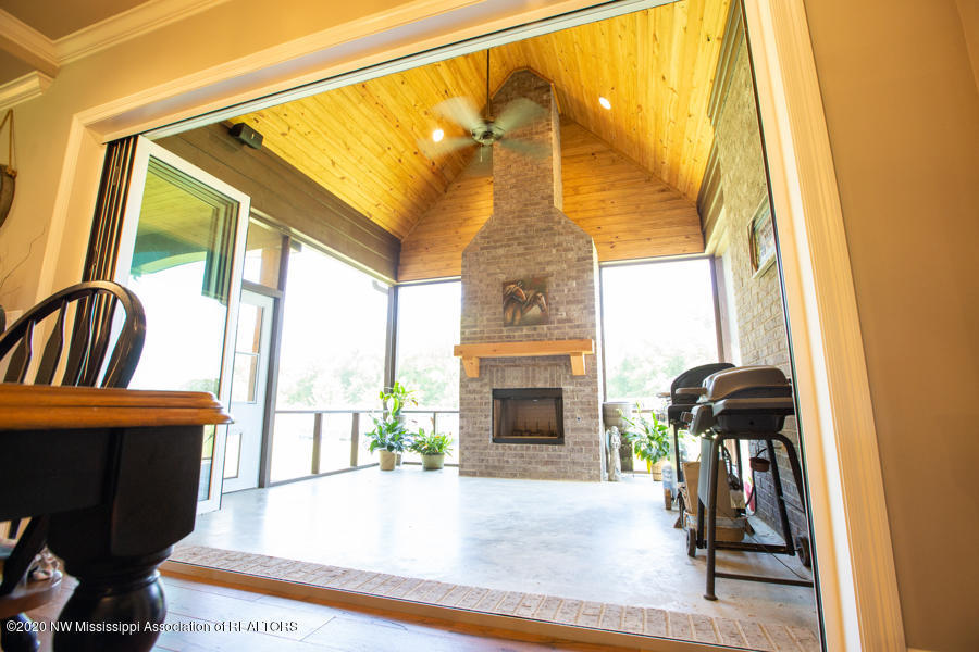 1664 Baker Road Lake Cormorant, MS 38641 - Photo 71 of 87 Screened in patio w/wood FP!