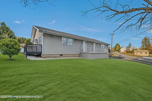 a backyard of a house with lots of green space