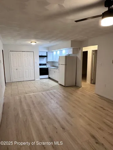 a view of a kitchen with a sink and dishwasher cabinets