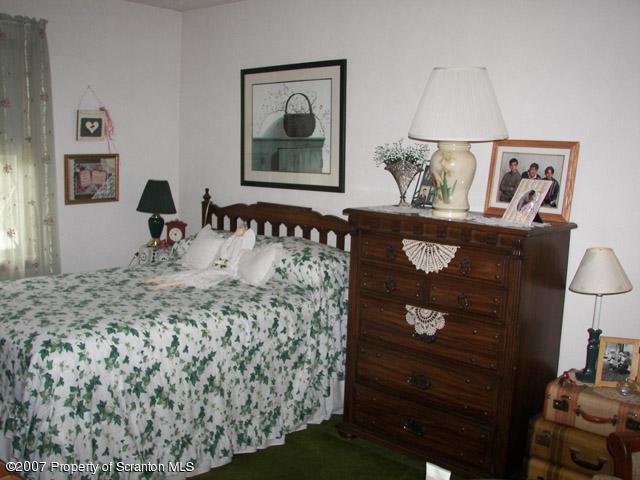 2 Rr Union Dale, PA 18470 - Photo 14 of 15 a bed sitting in a bedroom and painting on the wall