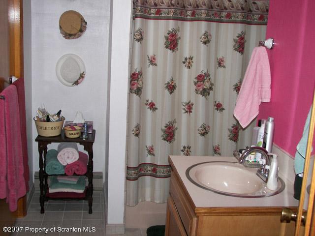 2 Rr Union Dale, PA 18470 - Photo 15 of 15 a bathroom with a sink and a mirror