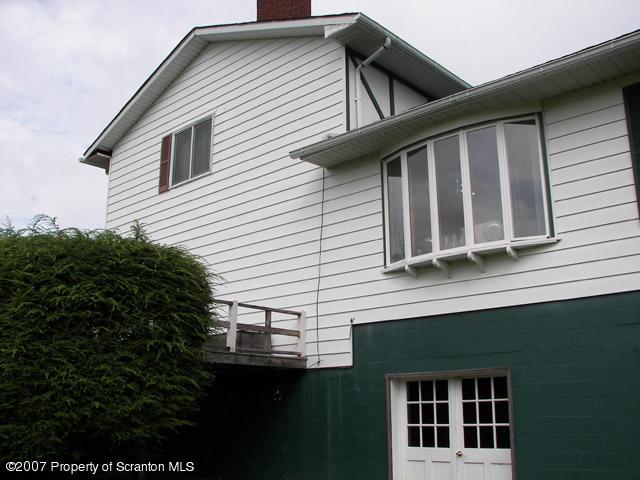 2 Rr Union Dale, PA 18470 - Photo 3 of 15 a front view of a house with plants