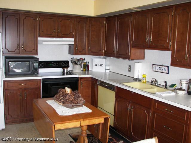 2 Rr Union Dale, PA 18470 - Photo 6 of 15 a kitchen with a sink stove and cabinets