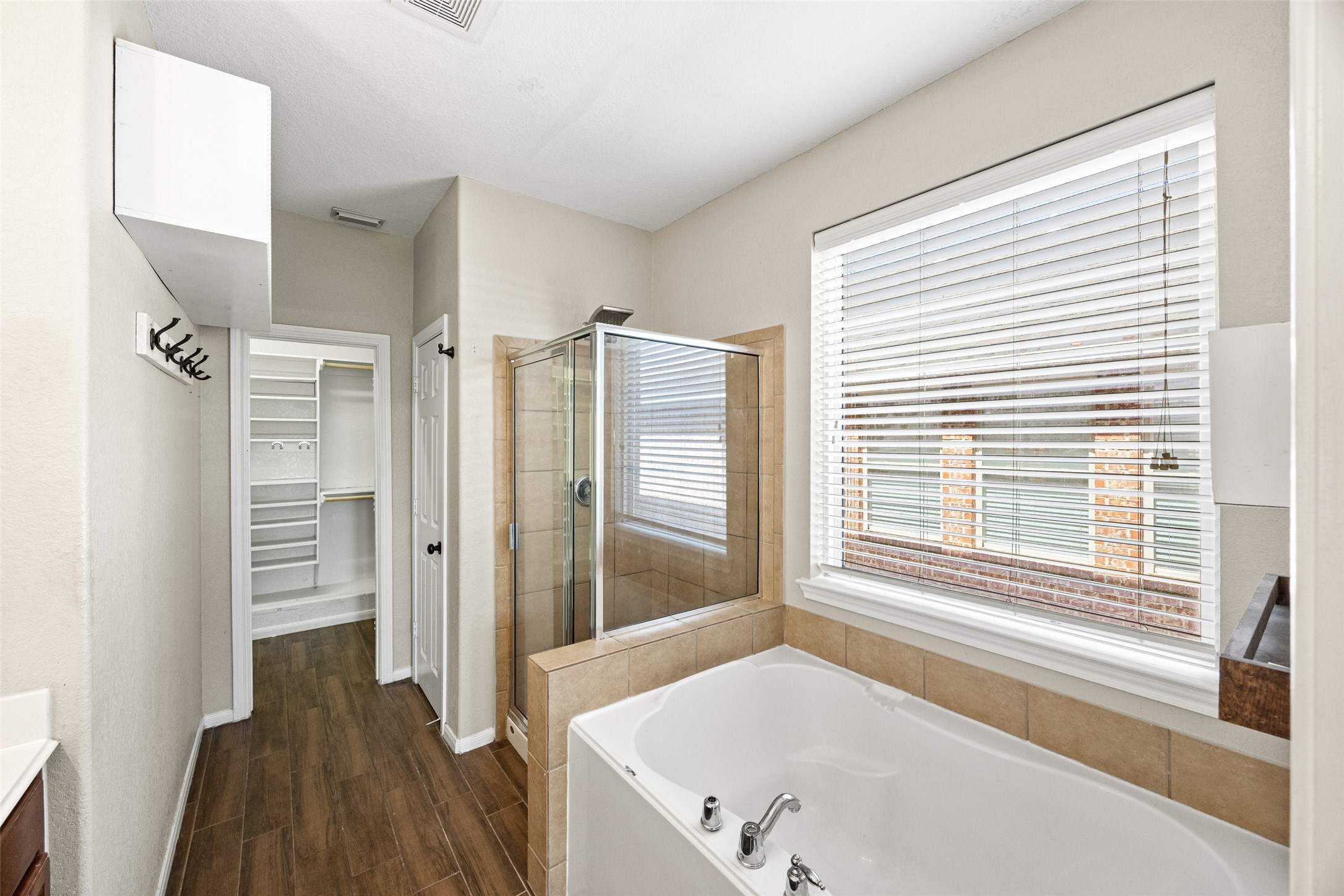 6014 Flagg Ranch Court Spring, TX 77388 - Photo 15 of 23 a bathroom with a tub and a window