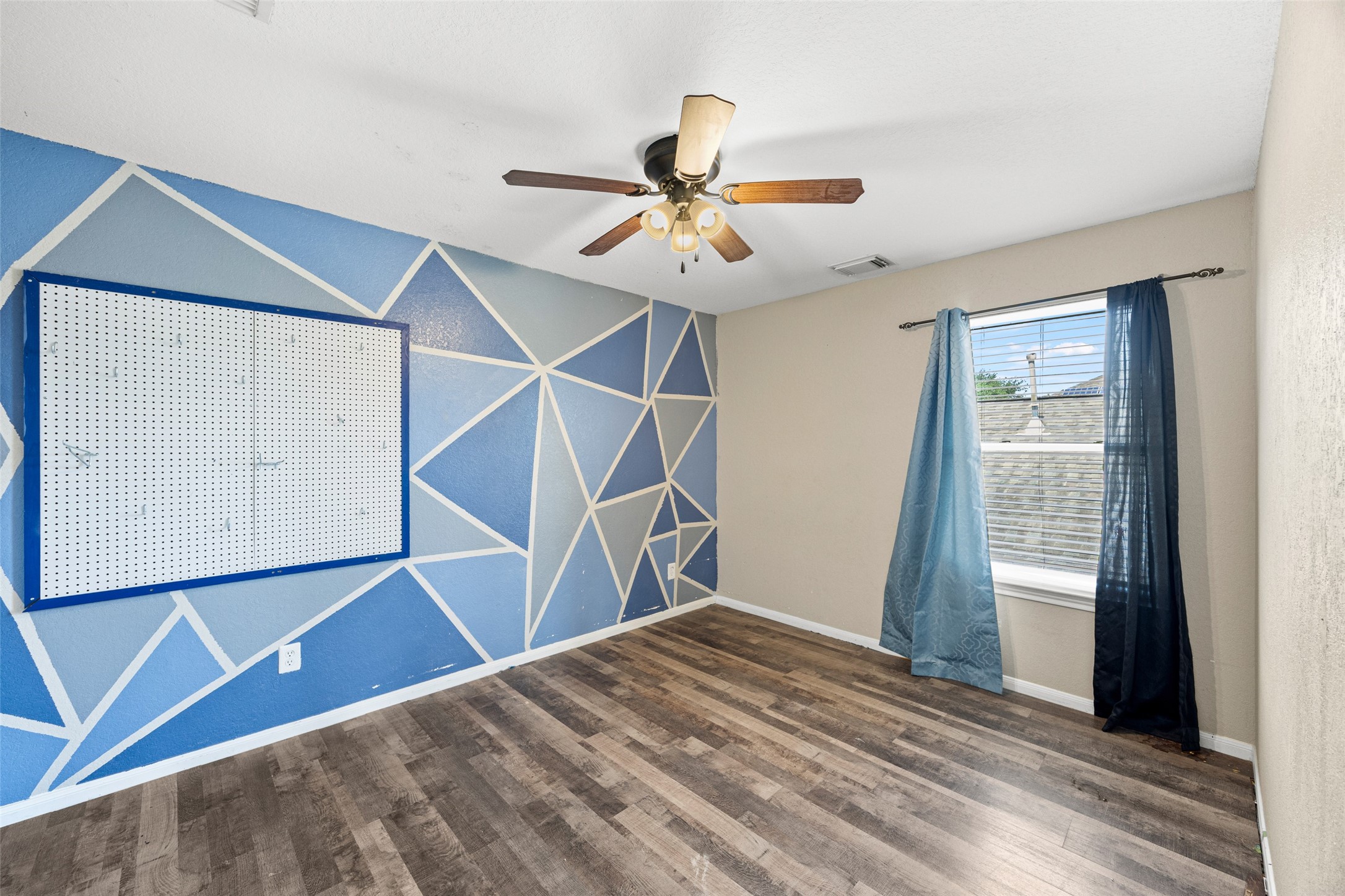 6014 Flagg Ranch Court Spring, TX 77388 - Photo 20 of 23 a view of a room with wooden floor and staircase