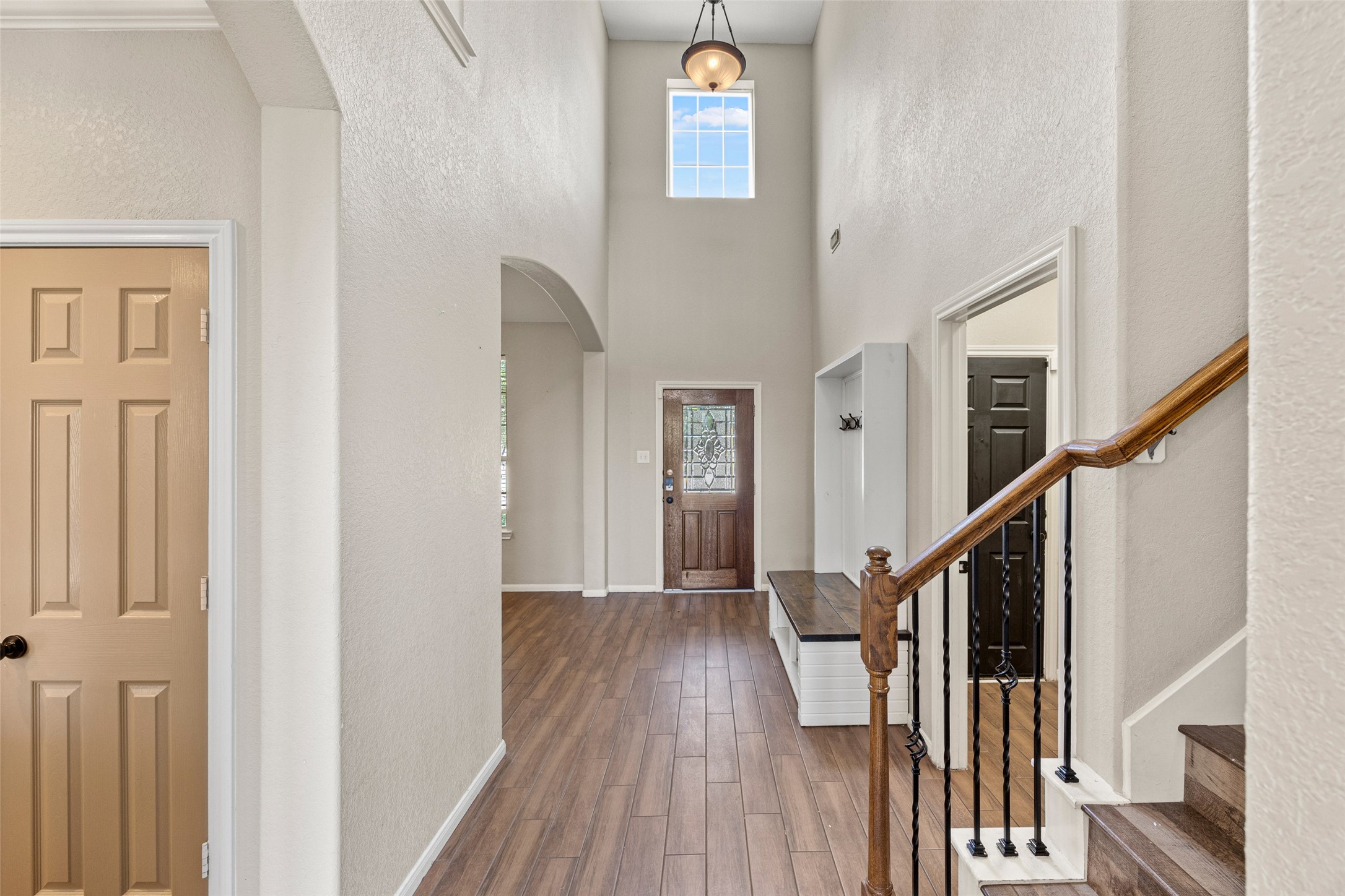 6014 Flagg Ranch Court Spring, TX 77388 - Photo 3 of 23 a view of a hallway with wooden floor and staircase