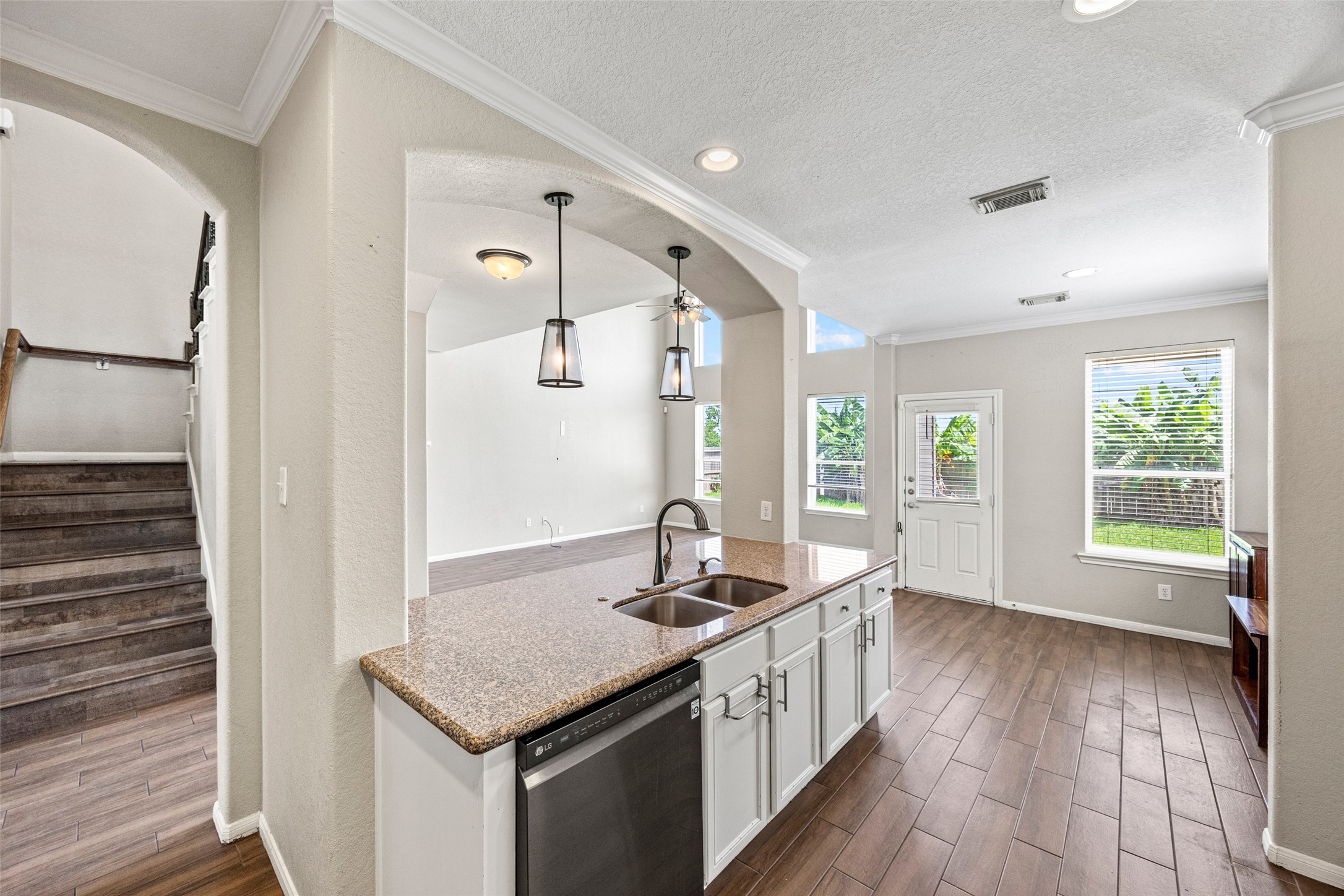 6014 Flagg Ranch Court Spring, TX 77388 - Photo 5 of 23 a kitchen with stainless steel appliances granite countertop a sink stove and wooden floor