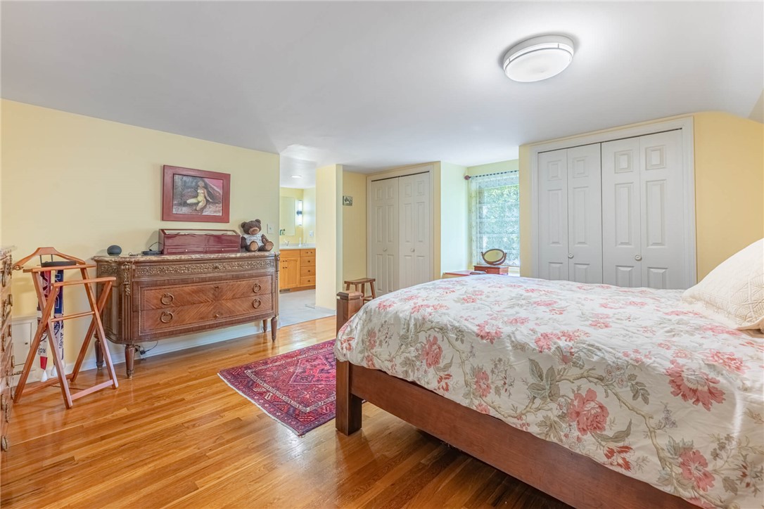 156 West Hadley Road Dayton, OH 45419 - Photo 25 of 71 This spacious bedroom features lustrous hardwood flooring, ample closet space, and an en-suite bathroom.