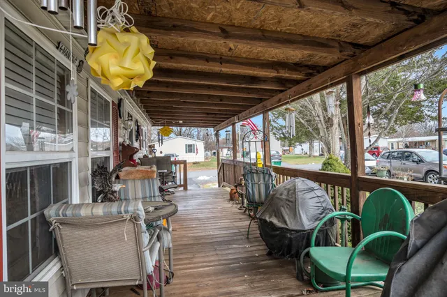 a view of a chairs and table in patio