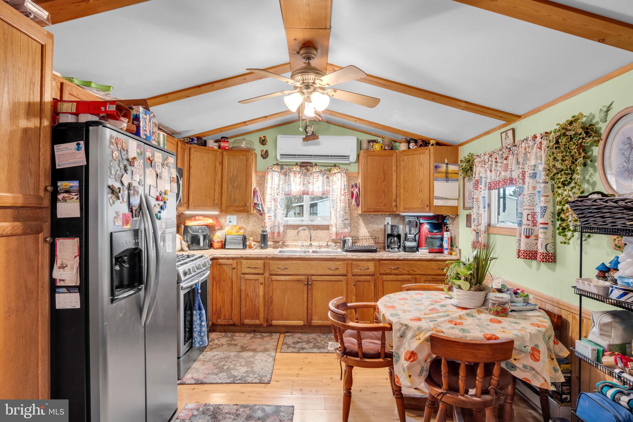 63 Big Spring Terrace Newville, PA 17241 - Photo 3 of 23 a kitchen with stainless steel appliances kitchen island granite countertop a refrigerator and a dining table