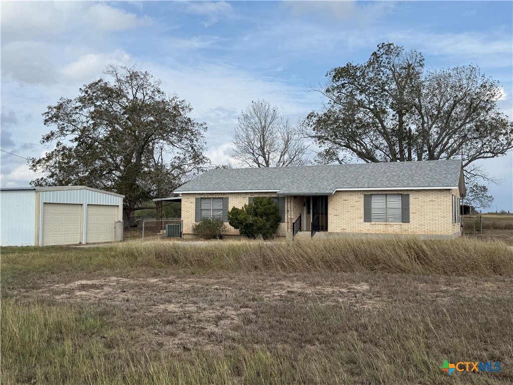 4689 County Road 302 Runge, TX 78151 - Photo 2 of 40 front view of house with a yard