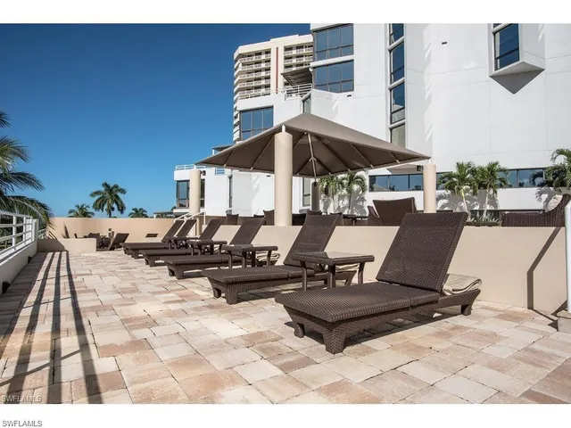 a view of a backyard with sitting area