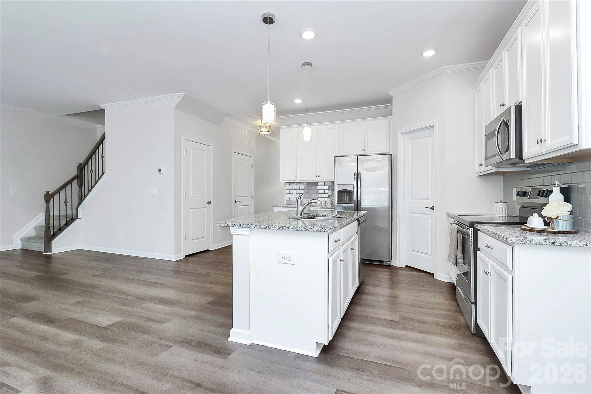 769 River Park Road Belmont, NC 28012 - Photo 11 of 41 a kitchen with stainless steel appliances a refrigerator sink and cabinets