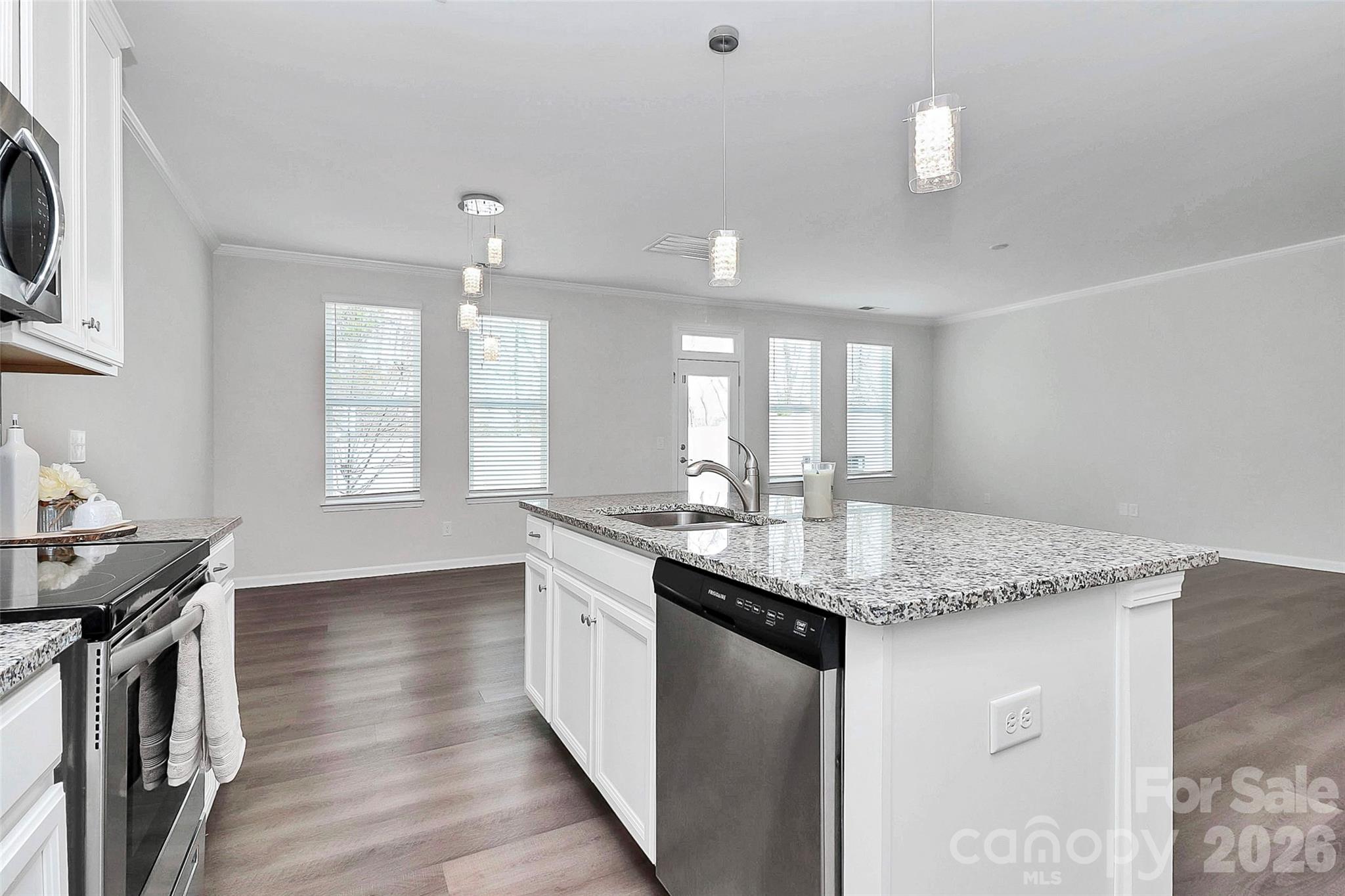 769 River Park Road Belmont, NC 28012 - Photo 13 of 41 a kitchen with granite countertop a sink a counter space appliances and cabinets