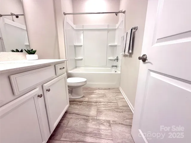 a bathroom with a sink a toilet and a bathtub