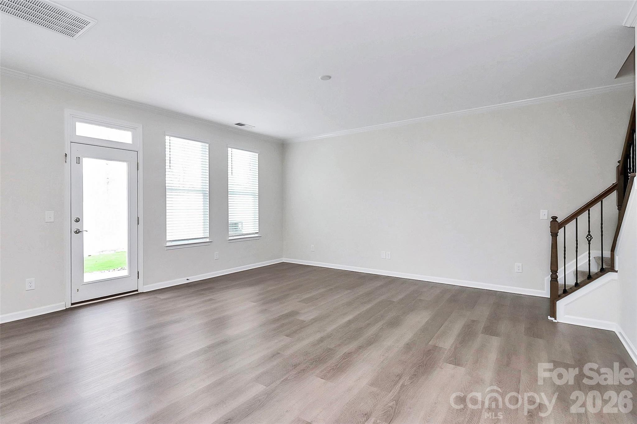 769 River Park Road Belmont, NC 28012 - Photo 16 of 41 a view of an empty room with wooden floor and a window