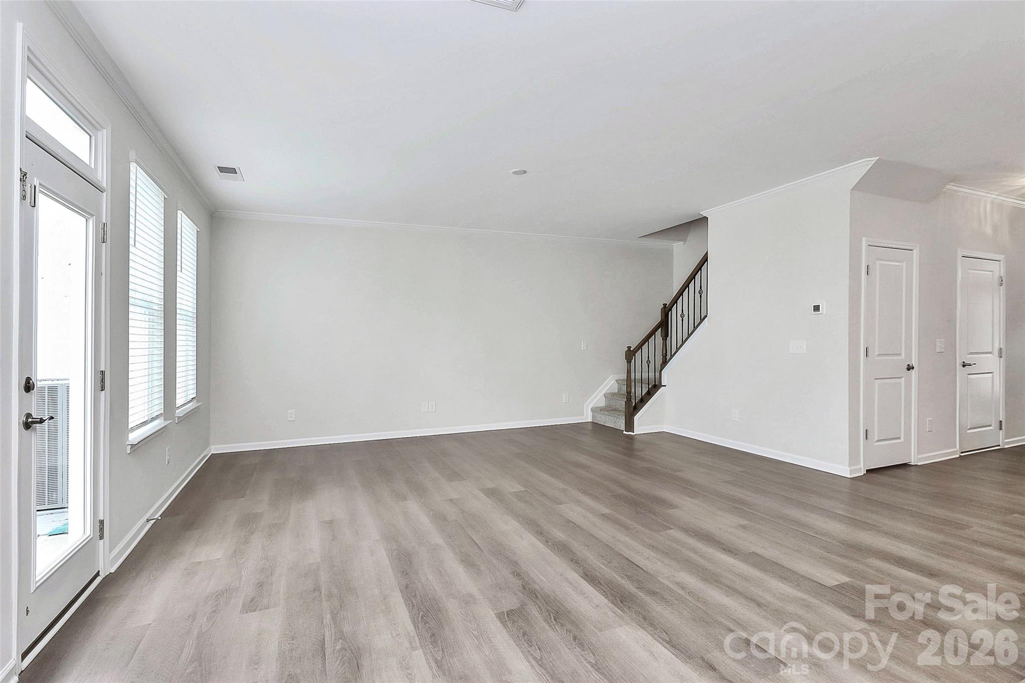 769 River Park Road Belmont, NC 28012 - Photo 17 of 41 a view of an empty room with wooden floor and a window