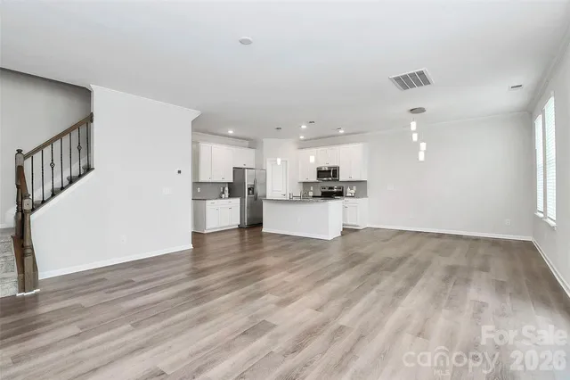 a bathroom with a double vanity sink a large mirror and shower
