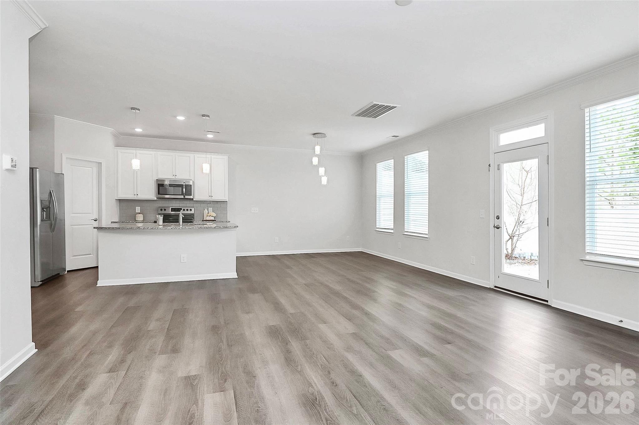 769 River Park Road Belmont, NC 28012 - Photo 19 of 41 a view of kitchen with wooden floor and window