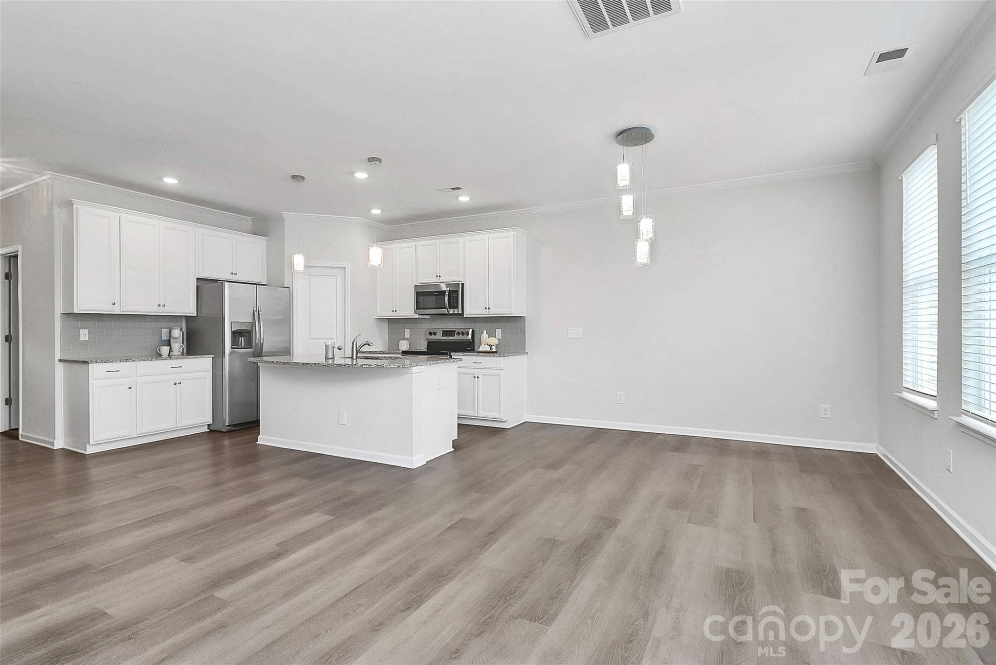 769 River Park Road Belmont, NC 28012 - Photo 21 of 41 a view of kitchen with wooden floor and window