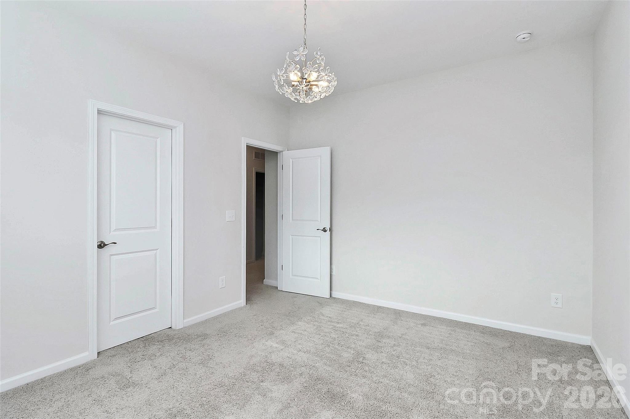 769 River Park Road Belmont, NC 28012 - Photo 33 of 41 a view of a chandelier in big room and chandelier fan